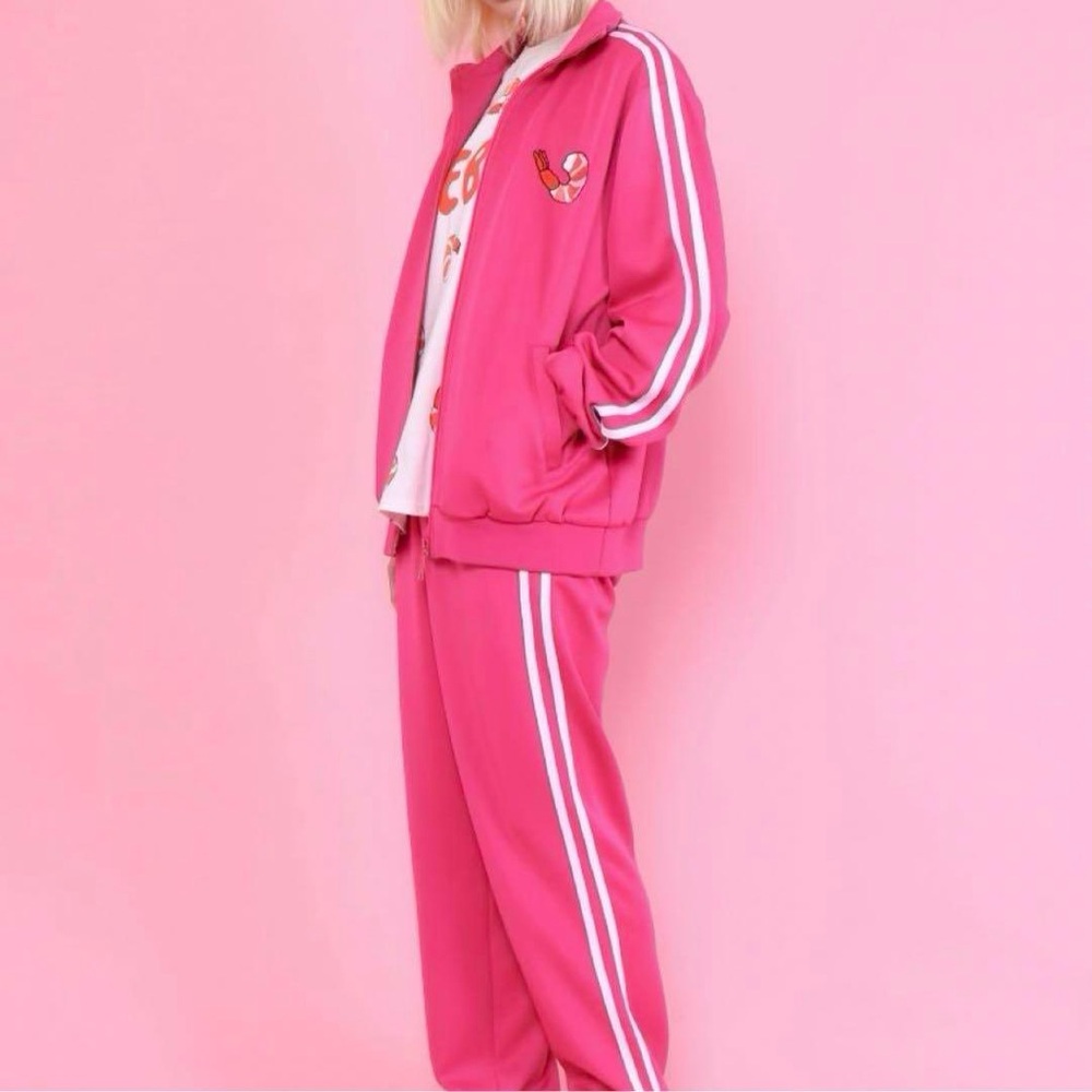 pink zip-up jacket by PUNYUS features shrimp embroidery for a unique look.